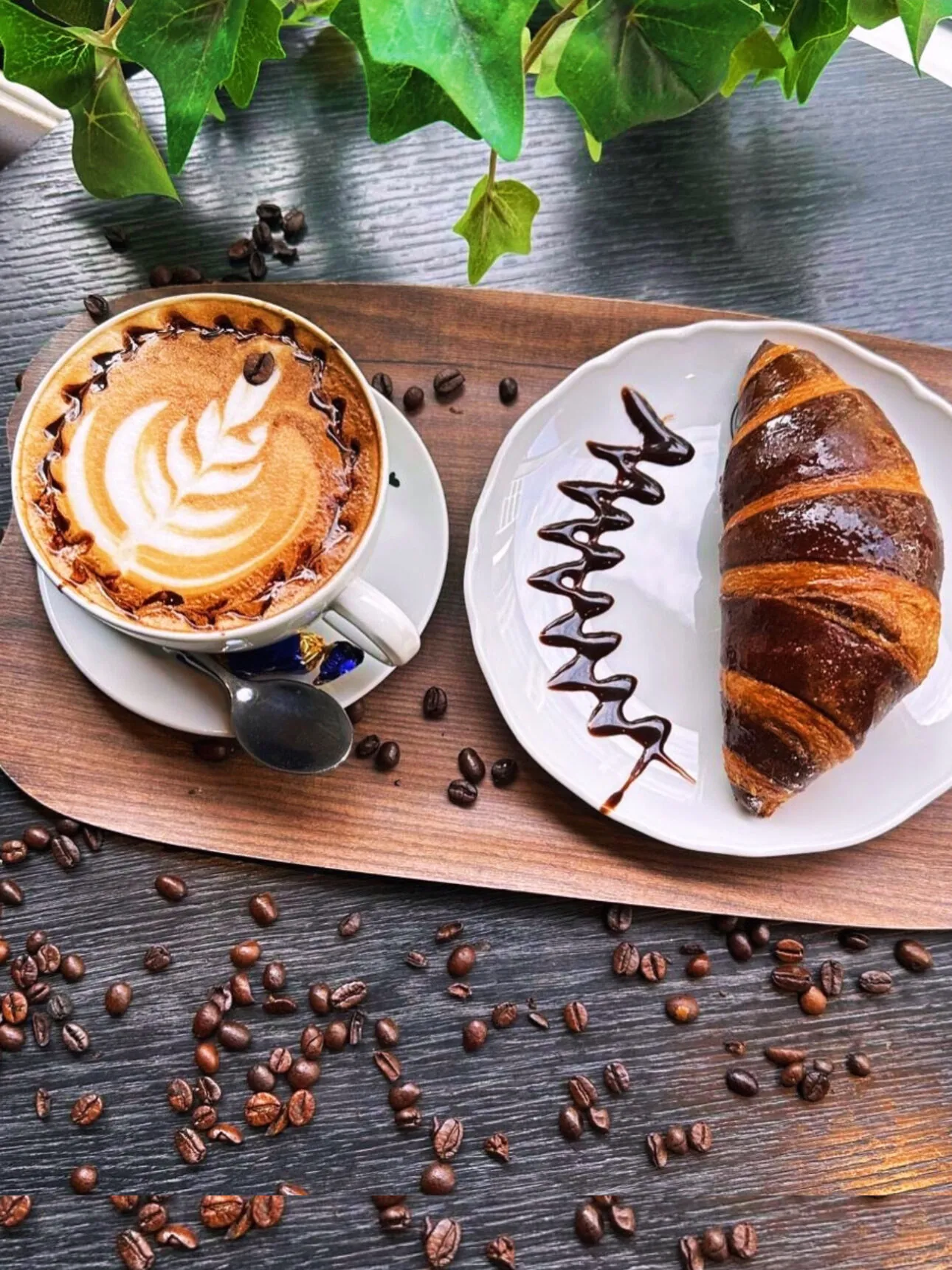 Cappuccino and croissant at Candela Coffee
